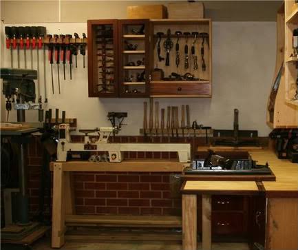 Inside the Heartwood workshop — bench, hand plane and stacked timber