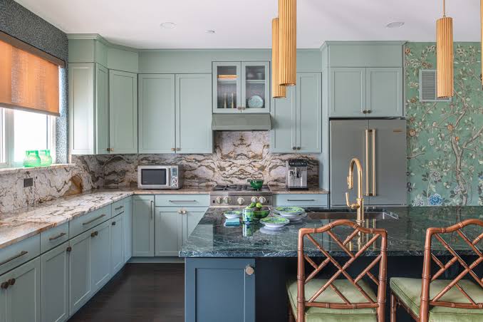 Custom fitted kitchen with navy shaker cabinetry and warm wood accents